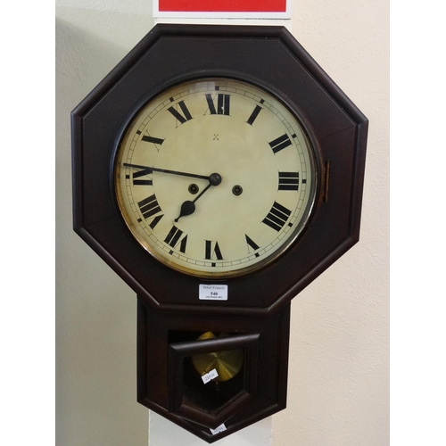 540 - Victorian stained octagonal two train wall clock with key and pendulum.  (B.P. 21% + VAT)