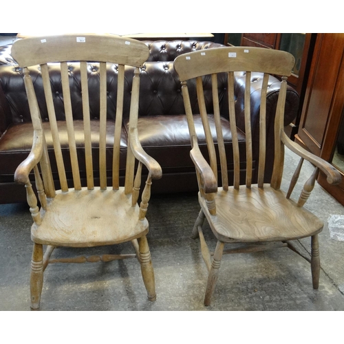 555 - Two similar late 19th century beech and elm fireside armchairs.  (2)   (B.P. 21% + VAT)