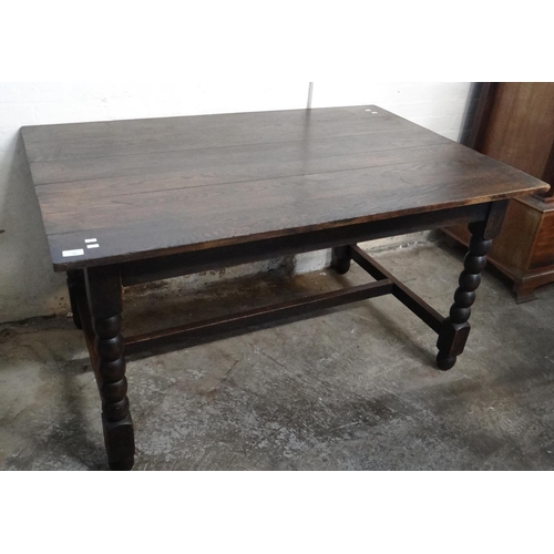 558 - Mid century oak dining table with centre stretcher and bobbin turned legs.  138x91x76cm approx.   (B... 