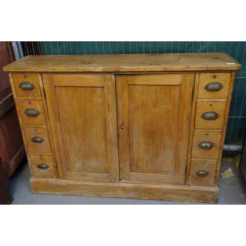 560 - Small two door pine multi drawer sideboard.   (B.P. 21% + VAT)