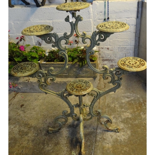 568 - Cast metal six tier scroll work plant pot stand.   (B.P. 21% + VAT)