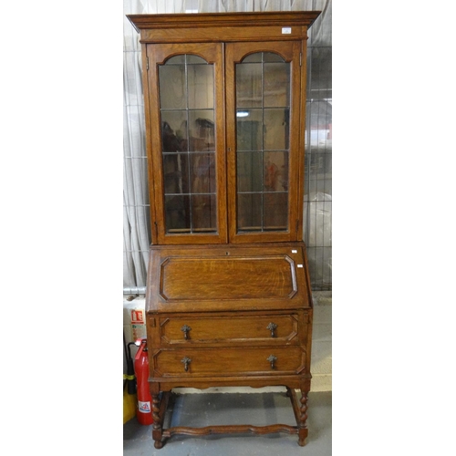 575 - Early 20th Century oak two stage glazed and leaded bureau bookcase.
(B.P. 21% + VAT)