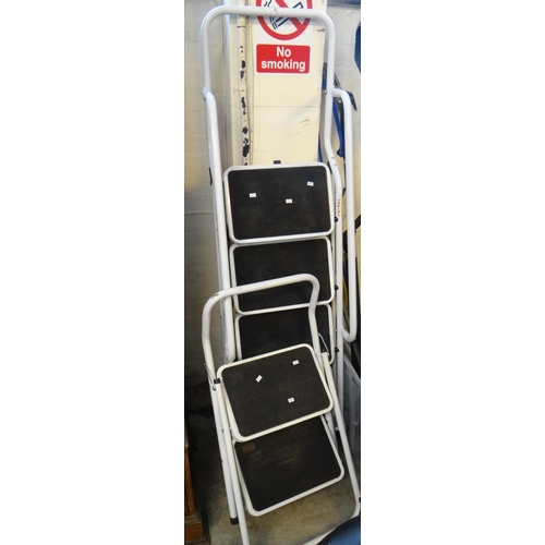 579 - Two tubular folding step ladders: two tread and four tread.  (2)   (B.P. 21% + VAT)