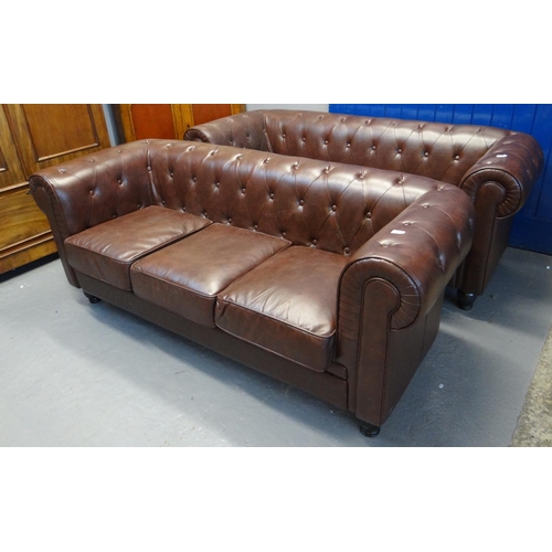 582 - Pair of modern brown leather Chesterfield style three seater sofas with shaped arms on turned balust... 