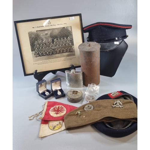 190 - Wicker box of assorted Miliaria items to include: Cap, photograph, Forage cap with badges, Welsh Ber... 