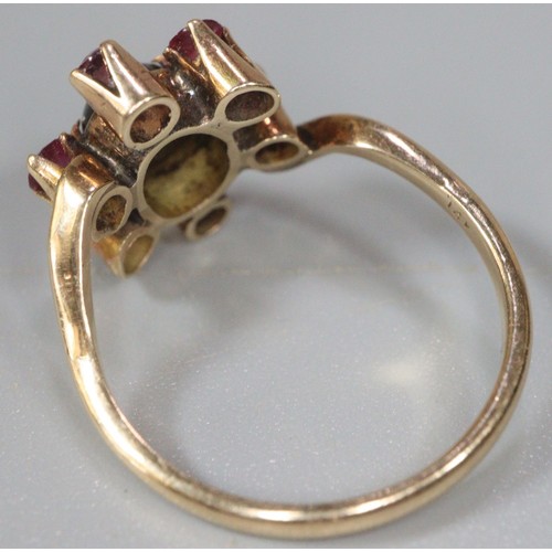 235 - 14K gold red seven stone flowerhead dress ring.  Size L.  2.4g approx.  (B.P. 21% + VAT)