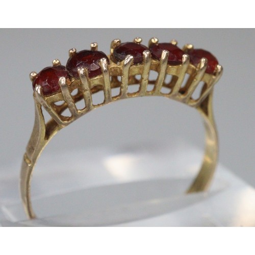 241 - 9ct gold five stone probably Garnet dress ring.  1.5g approx.  Size N1/2.  (B.P. 21% + VAT)