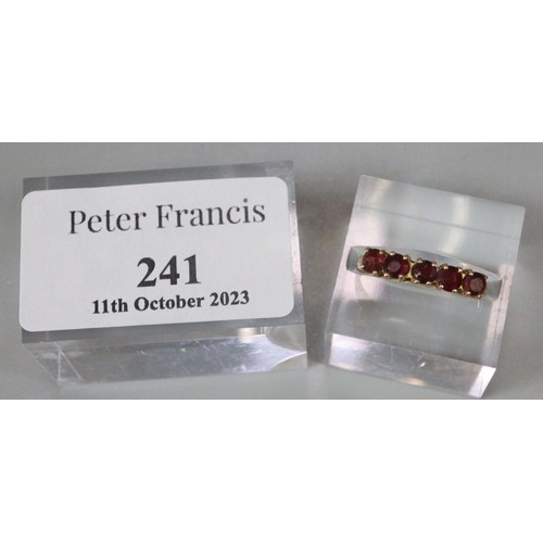 241 - 9ct gold five stone probably Garnet dress ring.  1.5g approx.  Size N1/2.  (B.P. 21% + VAT)