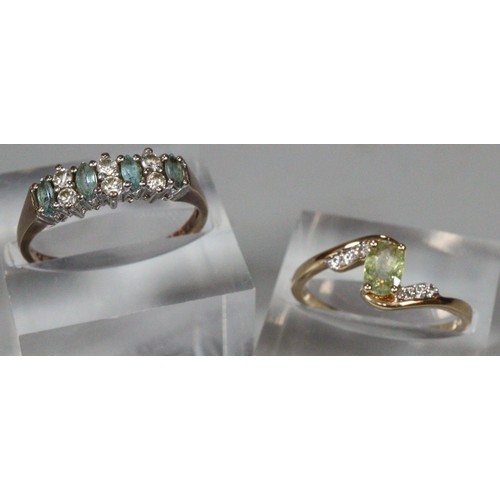 250 - Two 9ct gold dress rings with green, blue and coloured stones.  4.3g approx.  Sizes O1/2 and N.  (2)... 