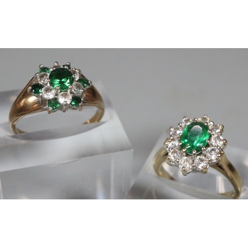 251 - Two 9ct green and clear stone flowerhead rings.  6.7g approx.  Sizes H and K.  (2)  (B.P. 21% + VAT)