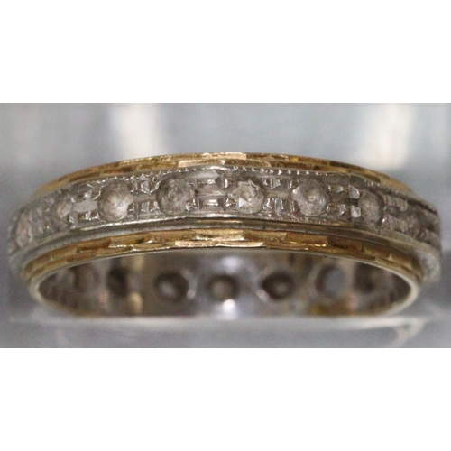 239 - 18ct gold eternity ring.  3.1g approx.  Missing one stone (not diamonds).   (B.P. 21% + VAT)