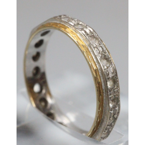 239 - 18ct gold eternity ring.  3.1g approx.  Missing one stone (not diamonds).   (B.P. 21% + VAT)