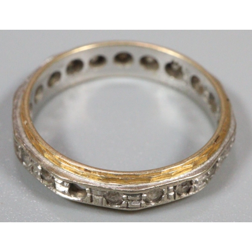 239 - 18ct gold eternity ring.  3.1g approx.  Missing one stone (not diamonds).   (B.P. 21% + VAT)