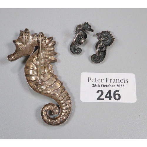 246 - Silver seahorse brooch an a pair of matching earrings marked Sterling.   (B.P. 21% + VAT)