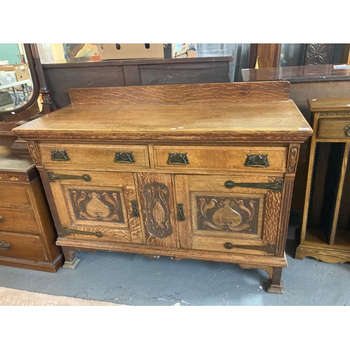 468 - Arts and Crafts oak sideboard with carved organic designs and hinges.  (B.P. 21% + VAT)