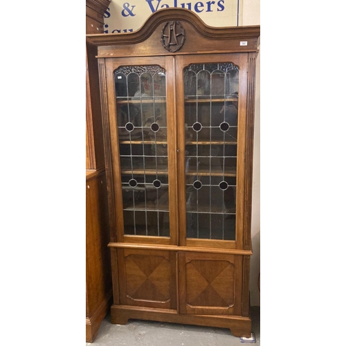 485 - Early 20th century mahogany two door glazed stained glass and leaded bookcase on bracket feet.  (B.P... 