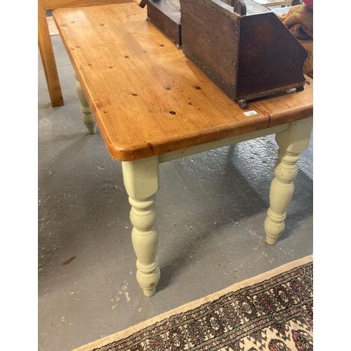 496 - Modern pine kitchen table on painted baluster turned legs.  137x74x76cm approx.  (B.P. 21% + VAT)