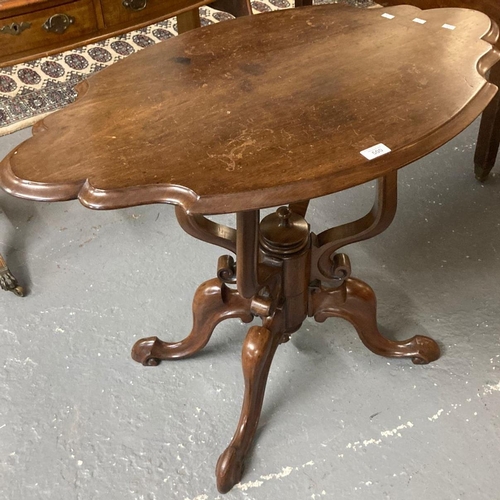 500 - Victorian style mahogany table, the shaped oval top above a carved ornate quatrefoil base.  (B.P. 21... 