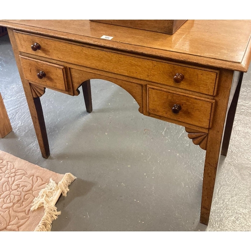 505 - 19th century oak lowboy, the moulded top above an arrangement on one long and two small drawers with... 