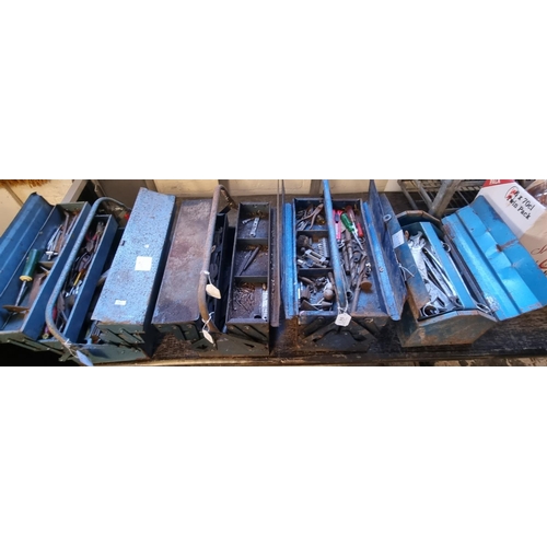 515 - Four metal cantilever and other tool boxes containing a wide selection of assorted spanners and othe... 