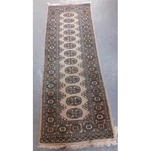 523 - Three modern Bokhara style cream ground runner.  248x84cm approx and 181x64cm approx.  (3)   (B.P. 2... 