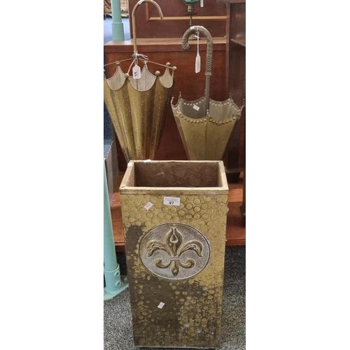 87 - Two similar brass stick stands in the form of umbrellas together with another brass stick stand of r... 