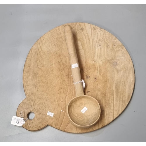 92 - Light elm baking slab together with a beech cawl spoon.  (2) (B.P. 21% + VAT)