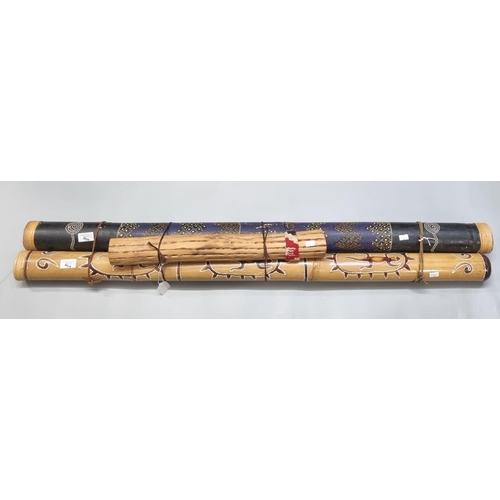 94 - Large hand painted Didgeridoo together with two Rainsticks.  (3)   (B.P. 21% + VAT)