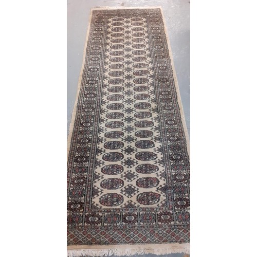 523 - Three modern Bokhara style cream ground runner.  248x84cm approx and 181x64cm approx.  (3)   (B.P. 2... 