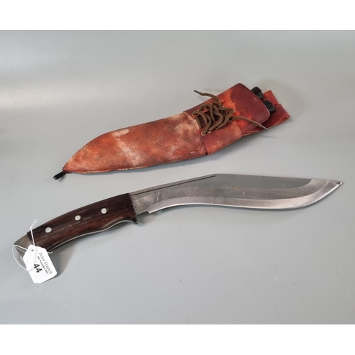 44 - Nepalese Kukri with hardwood handle and leather scabbard with two small additional knives.  (B.P. 21... 