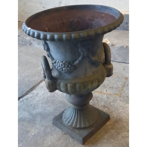 475 - Weathered cast iron Campana shaped two handled garden urn.  61cm high approx.   (B.P. 21% + VAT)