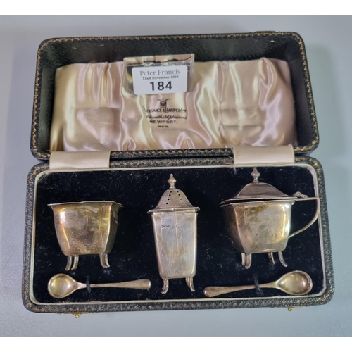 184 - Cased silver condiment set with blue glass liners.  2.45 troy oz approx.   (B.P. 21% + VAT)