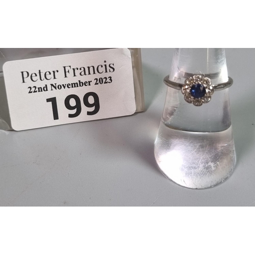 199 - Platinum eight stone diamond daisy ring with central sapphire stone.  2.2g approx.  Size K1/2.   (B.... 