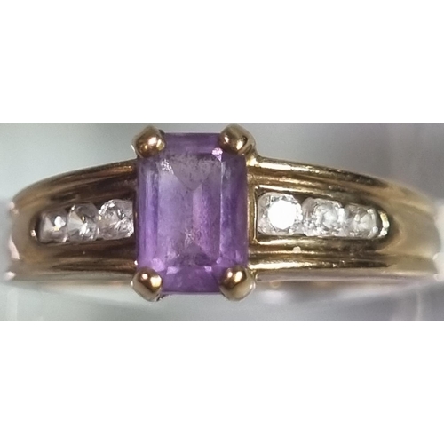 214 - 9ct gold, cubic zirconia and  purple stone dress ring.  2.3g approx.  Size K.  (B.P. 21% + VAT)