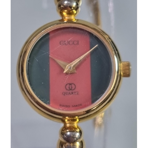 220 - Gucci 2047/L gold plated quartz wristwatch.  (B.P. 21% + VAT)