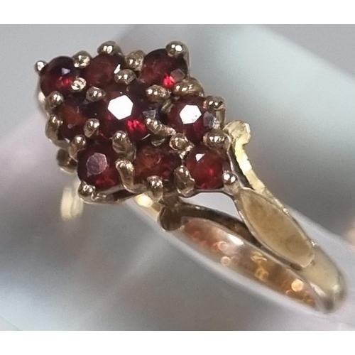 221 - 9ct gold garnet cluster dress ring.  2g approx.  Size L1/2.  (B.P. 21% + VAT)