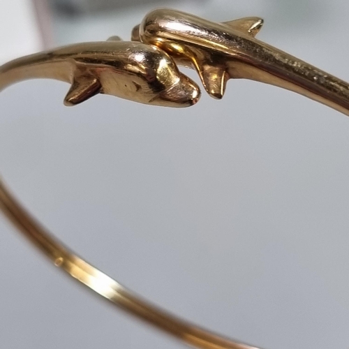 226 - 14ct gold Dolphin bangle/bracelet.  6g approx.  (B.P. 21% + VAT)