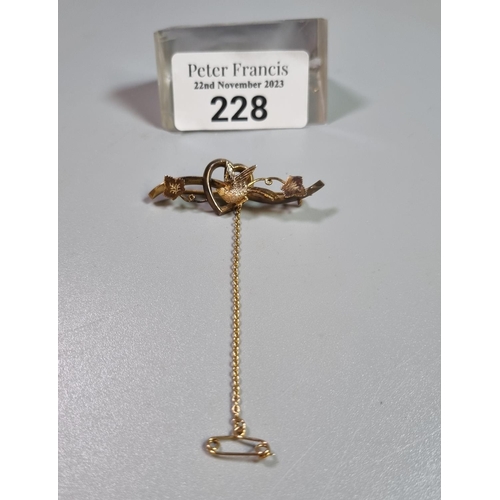 228 - 9ct gold sweetheart brooch, with swallow and foliage.  2.5g approx.  (B.P. 21% + VAT)