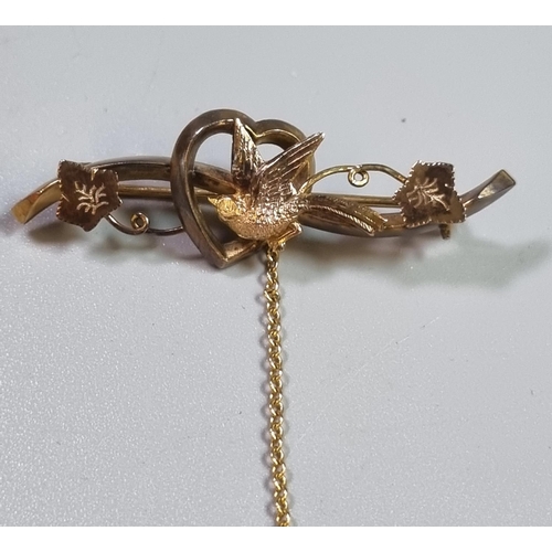 228 - 9ct gold sweetheart brooch, with swallow and foliage.  2.5g approx.  (B.P. 21% + VAT)