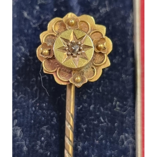 230 - Victorian 15ct gold stock pin with small central diamond chip.  1.4g approx.  In original Moroccan l... 