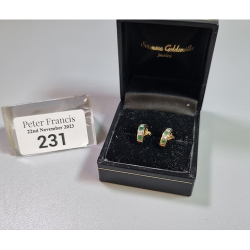 231 - Pair of 9ct gold diamond and emerald earrings.  1.8g approx. (B.P. 21% + VAT)