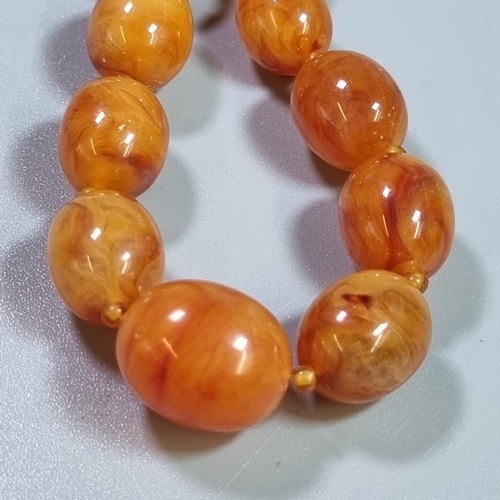 235 - 1930s butterscotch coloured Bakelite necklace.  36g approx. (B.P. 21% + VAT)