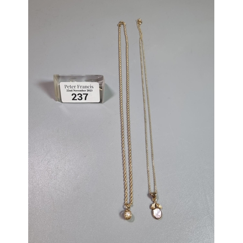 237 - Two 9ct gold silver fine chains each with pendants, a pearl and another.  5.5 g approx.  (B.P. 21% +... 