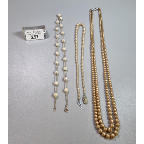 251 - 9K gold and pearl necklace together with two  simulated pearl necklaces.   (B.P. 21% + VAT)