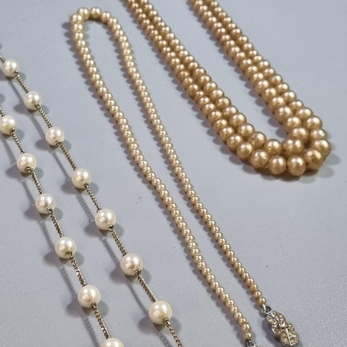 251 - 9K gold and pearl necklace together with two  simulated pearl necklaces.   (B.P. 21% + VAT)