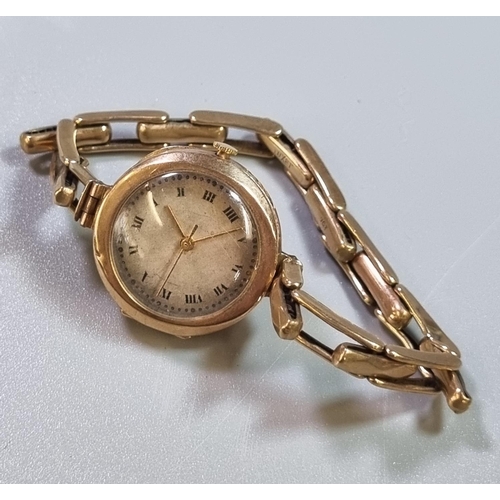 262 - 9ct gold ladies mechanical wristwatch with Roman face and expanding 9ct gold bracelet.  13g approx. ... 