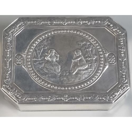 282 - White metal octagonal snuff box, the top depicting figures in a garden setting, the interior with Ge... 