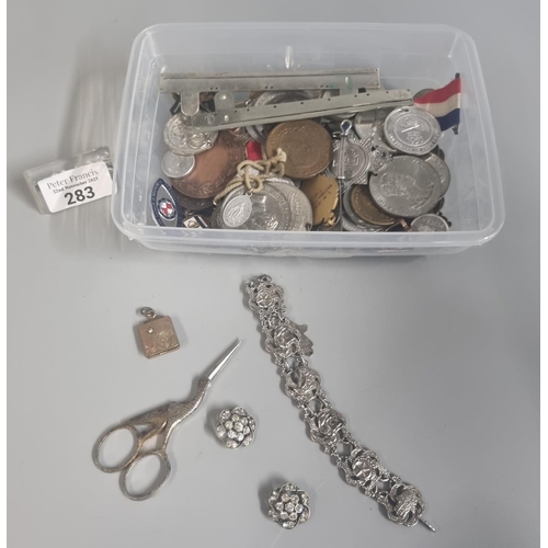 283 - Tub of assorted items to include: Royal Life Saving Society Medal, coins, medallions, rolled gold lo... 