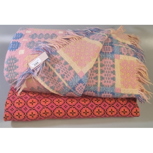 299 - Pink ground Welsh woollen tapestry traditional Caernarfon design fringed edge blanket, together with... 