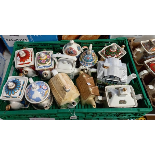 393 - Three trays of assorted modern pottery novelty teapots.  (3)  (B.P. 21% + VAT)